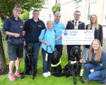 Provost Kenneth Duffy presents representatives of Guide Dogs with a cheque