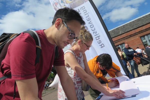 Visitors complete surveys for Rediscovering Airdrie