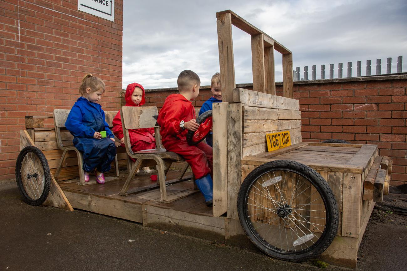 Children in wooden car Shawhead